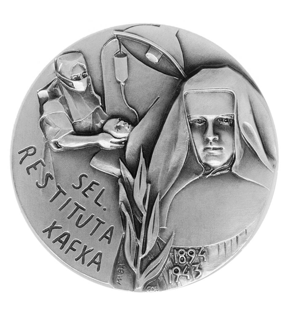 Medaille mit Abbild Restituta in schwarz-weiß